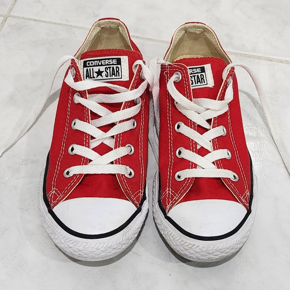 Kids red color converse in size 3 .